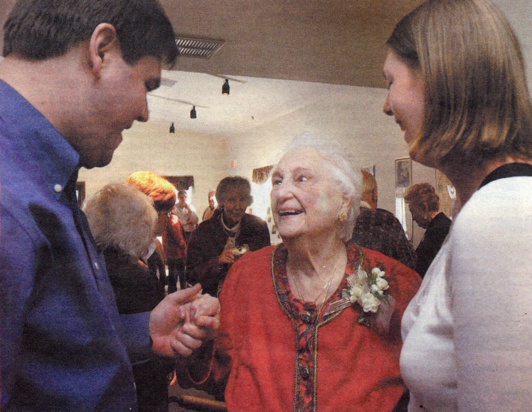 Min Steininger greets her great-nephew Peter Kolkay and great-niece Anna Kolkay during a birthday party held for her on Dec. 19 at St. John United Church of Christ.  Steininger, 95, is the oldest active member of the church and has seen 16 different pastors come and go over the years.
